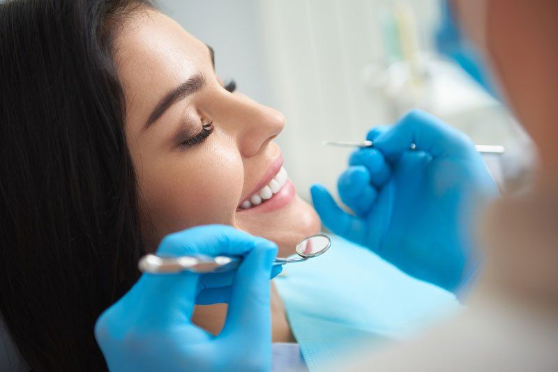 Dentist giving a checkup
